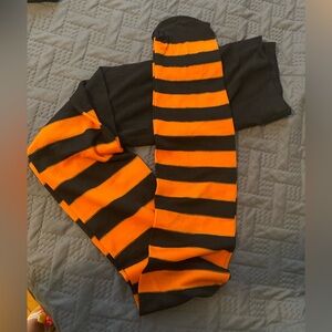 Women’s orange and black nylons sz M new